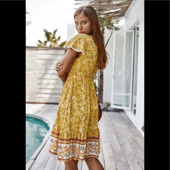 Yellow print V neck ruffle dress with front tie. - Picture 2 of 2